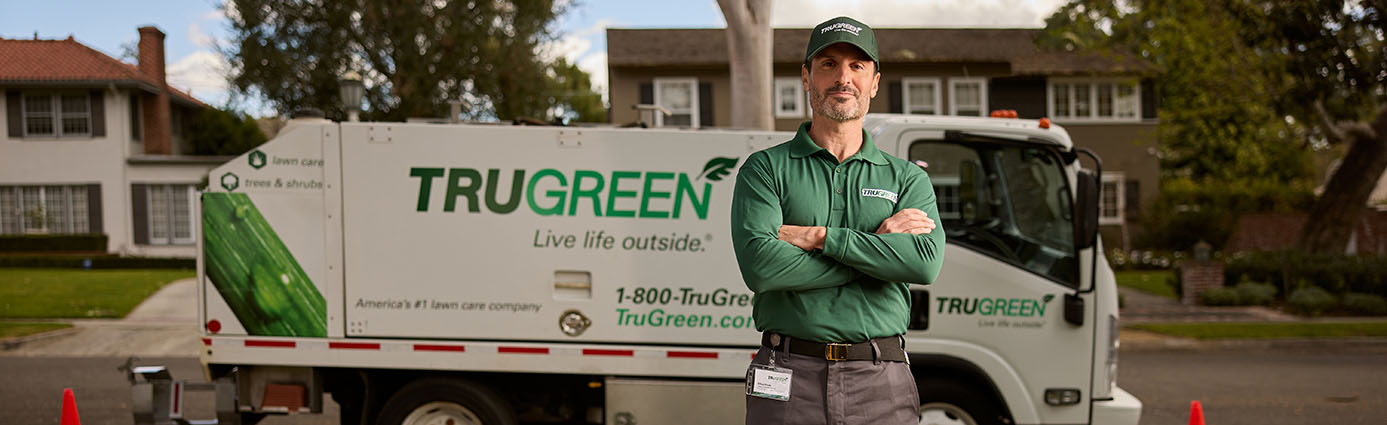 TruGreen lawn specialist with TruGreen truck