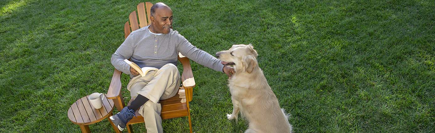 Pet and owner on healthy turf